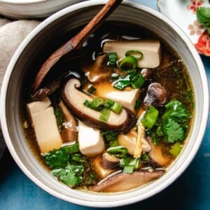 Recipe image shows fresh shiitake mushrooms and silken tofu in a clear shiitake broth.
